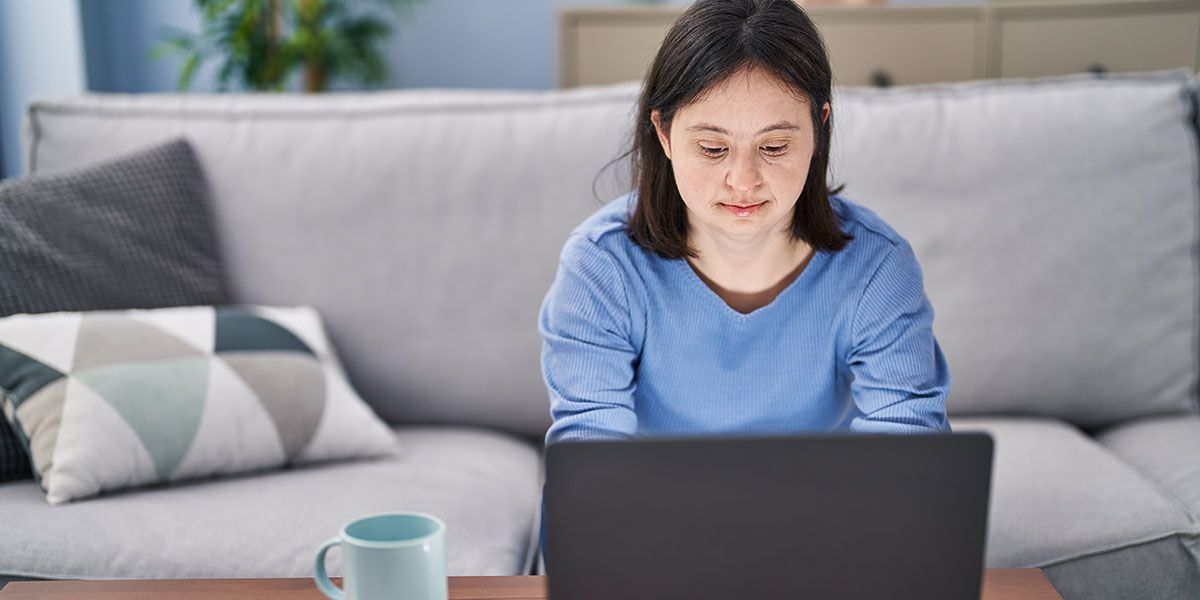 A visually impared man listening to audio descriptions.